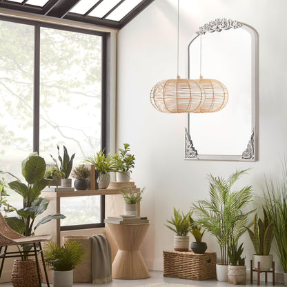 Miroir sur pied arqué en bois massif sculpté