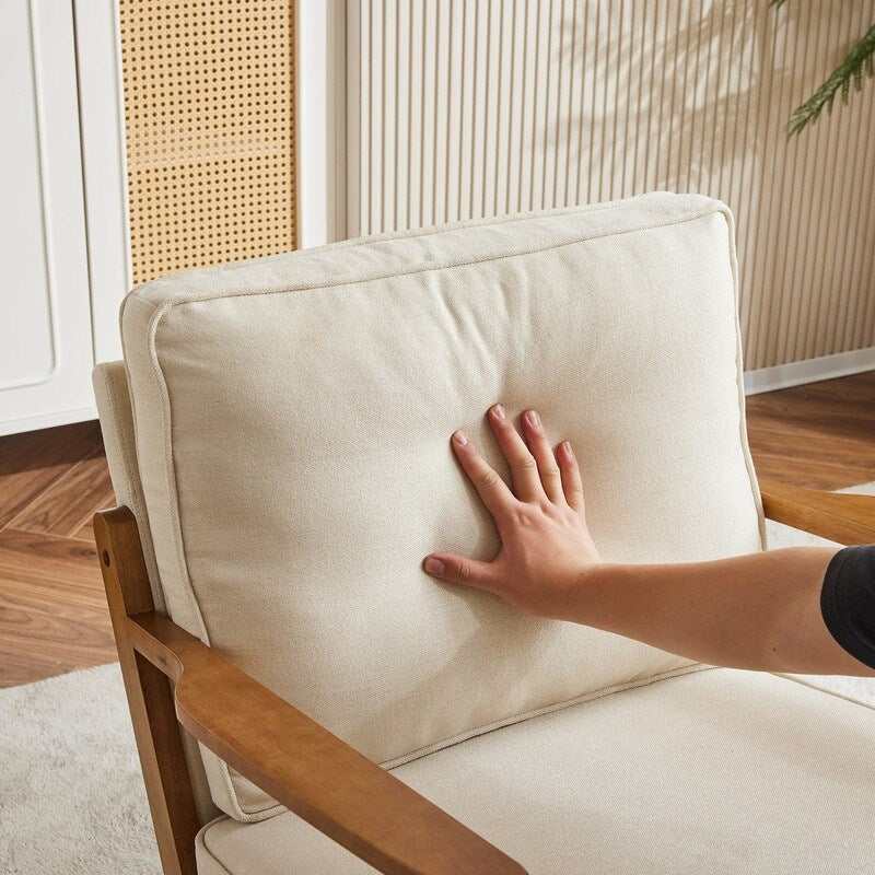 Fauteuil d'appoint beige en lin mélangé, pieds en bois et un coussin.